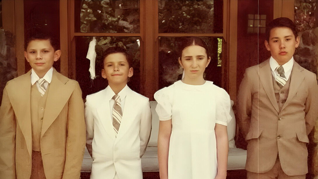 The four Roy siblings standing together with restrained expressions, representing the shared childhood wounds and fractured family bonds at the heart of Succession