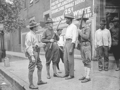 Chicago History: National Guardsmen question a Black man after the Chicago Race Riot in 1919