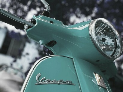 Italy breathes through its details: a Vespa, a slice of limone, and the silence between two hills that imagined a tragedy