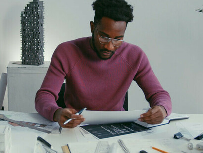 At the drawing board, the architect harnesses algorithms to create structures that prioritise energy efficiency and resource conservation