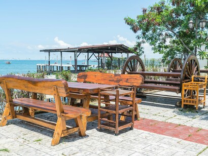 A waterfront seating area overlooking the sea, representing environmental design that supports safety and social engagement