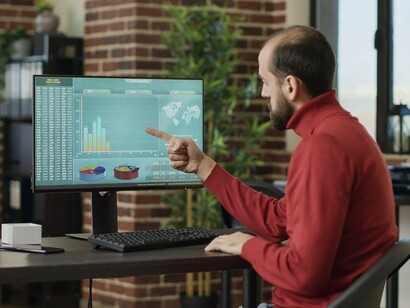Detailed performance charts being examined in real time, reflecting the industry's reliance on audience insights and behavioural data