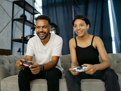 A couple enjoying quality time together while playing a console game and sharing their love for gaming