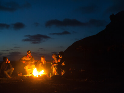 Around the fire. Photograph Chris Burkard