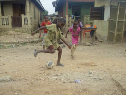 Kids practice their skills in dusty streets, reflecting a generation eager to build futures