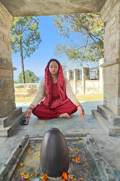 A pious Sanatani Hindu lady absorbed in prayers to Lord Shiva - The Hindu deity who preserves and protects Planet Earth, India