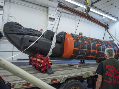 Stanley C. Hunt watches as Museum staff unload Monument at the Museum. Its massive size required careful handling and heavy equipment to transport, store, and exhibit the work of art. Courtesy of the Canadian Museum of History