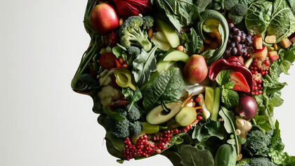 A human head filled with healthy foods and artificial intelligence, representing the fusion of functional foods and biohacking nutrition
