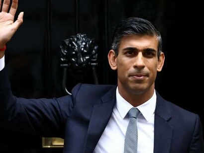 British Prime Minister Rishi Sunak waves in front of No. 10 Downing Street, London, UK