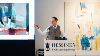 An auctioneer leads bidding during Hessink’s landmark contemporary art sale in Tbilisi, an event that marked a major turning point in the international recognition of Georgian modern and contemporary art, Georgia
