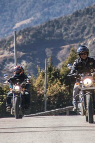 Pema Khandu minister riding a motorbike in the mountains of India
