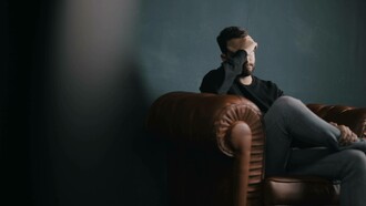 Man expressing exhaustion to therapist