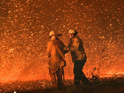 Firefighters try to put out fires
