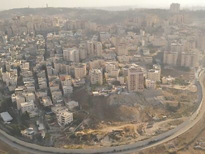 View the division between Israel and Palestine through an aerial perspective of the Security Wall, highlighting the Gaza Strip