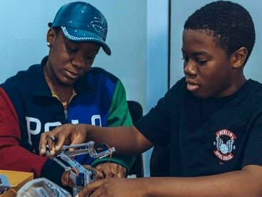 Students working together on a technology project in a tech class in Accra, reflecting how practical learning can turn knowledge into real-world skills
