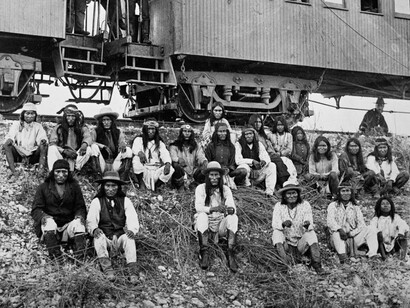 Geronimo and Chricahua Apache Prisoners with the prisoner train behind them, 1886