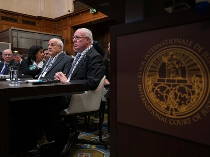 The judges of the International Court of Justice conducting a hearing session in the courtroom