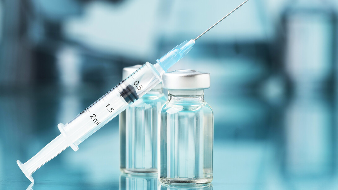 A poignant still life capturing the essence of the ongoing battle against COVID, featuring the symbolic presence of a vaccine