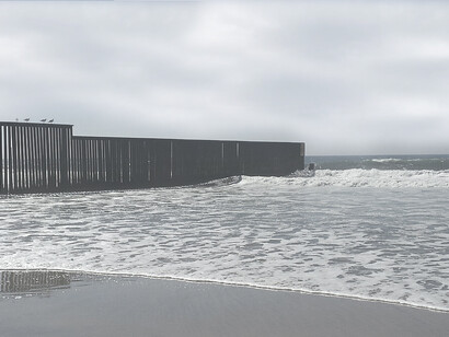 The border fence at the Initial Point of Boundary between the United States and Mexico along the Pacific Ocean, at Imperial Beach and Border Field State Park in Southern California