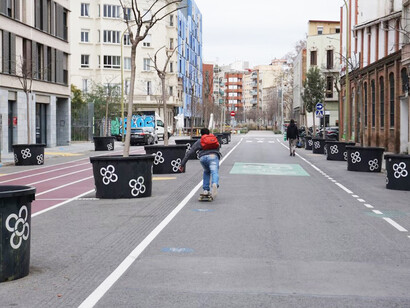 A designated bike lane painted along the side of a street in Barcelona, Spain