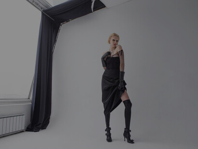 A model in sunglasses epitomizes luxury and modern fashion, featuring designer brands and cutting-edge style