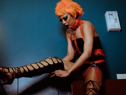 A transgender woman making sure their outfit fits perfectly