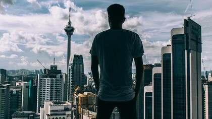 A man looking out in the capitalist world with the mantra of "every man for himself"