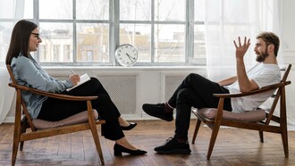 Man discusses his early childhood with therapist