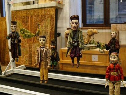 A display of expressive marionettes with distinct personalities, reflecting the creativity of traditional performance art