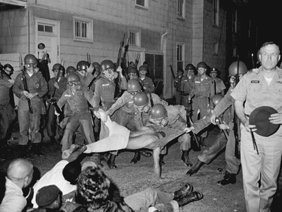 Clifford Vaughs, another SNCC photographer, is arrested by the National Guard, Cambridge, Maryland, 1964. Gelatin silver print, 11 x 14 inches. © Danny Lyon, New York & Magnum Photos, New York / Courtesy Edwynn Houk Gallery, New York.