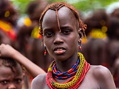 The focused gaze of this Kisii boy serves as a silent testament to the enduring spirit and cultural identity of the Kisii people