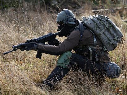 A soldier fighting for his country while accumulating severe losses for humanity