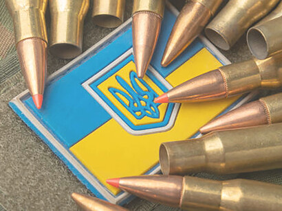 Amidst the Ukrainian flag, bullets and camouflage symbolize the army's challenges and strength