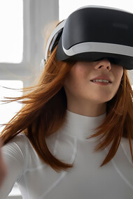 The future of fitness with a woman utilizing VR glasses, showcasing the integration of wearable devices and smart technology in the realm of technological disruptions