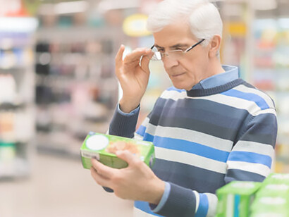 A mindful consumer inspects products with care at the market