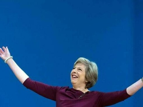 Prime Minister Theresa May arrives on stage to deliver her keynote speech