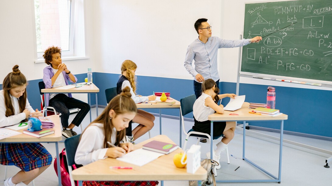 Teacher and students in a classroom; learning time