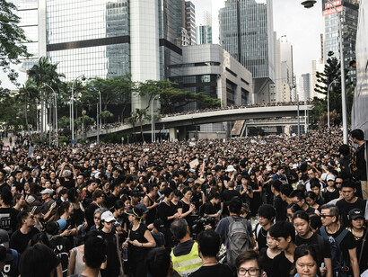 Crowds of protesters fill the streets of Hong Kong, demanding political reform, social justice, and greater democratic freedoms