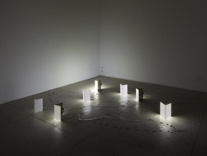 Installation view, The Host and the Cloud (mask), 2010, Led, Brass, Elastic, Hand Controller and  custom box packaging
5 7/8 X 6 1/4 X 9 1/2 in. ( 15 X 16 X 24 cm )
Photo: Guillaume Ziccarell