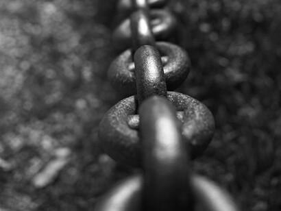 Close up of thick iron chain, an ominous reminder of a bleak past 