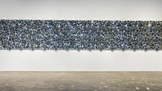 Robert Hickman, DMMDIA, 2014, mirror mosaic, 4' x 48'.  Photo by Etienne Frossard.  Image courtesy of Smack Mellon.