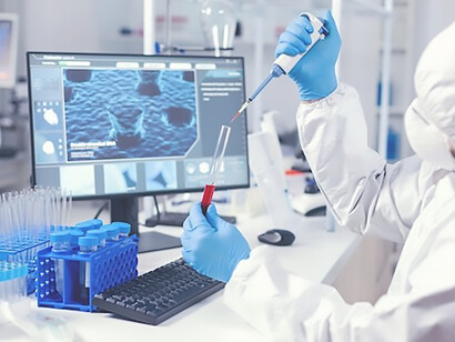 Medical engineer using dispenser to take sample of blood from test tube in lab
