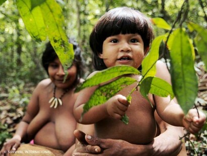A small Awá, smiling to the camera