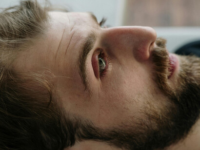 Close up shot on a man on his back, deep in reflection