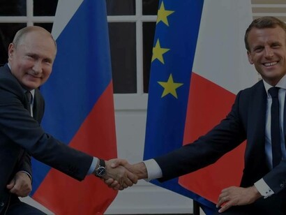Putin and Macron in the village of Bormes-les-Mimosas in southeastern France