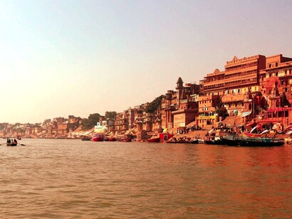 Some meditate to the rising sun oblivious of the surroundings, Varanasi, India