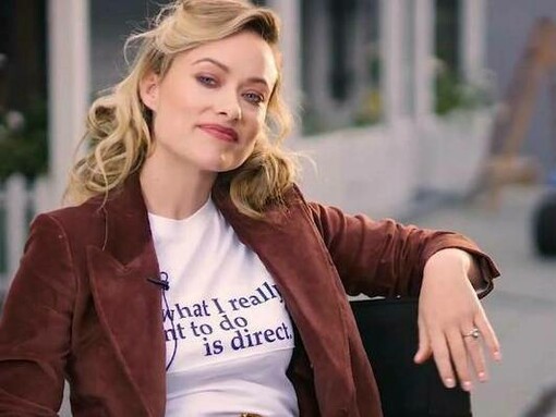 Olivia Wilde being interviewed in her director's chair