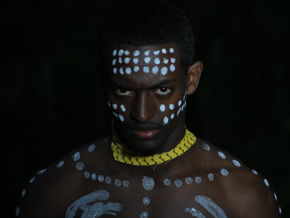 An African fantasy warrior wearing a skull-shaped mask