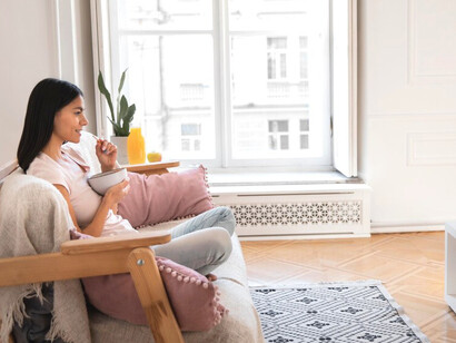 As streaming habits evolve, the woman watches a weekly episode of her favourite series, embracing the return of slower, more deliberate viewing with space for discussion and anticipation