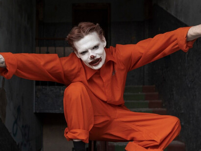 A clown that represents the mad Russian archetype, violent and erratic